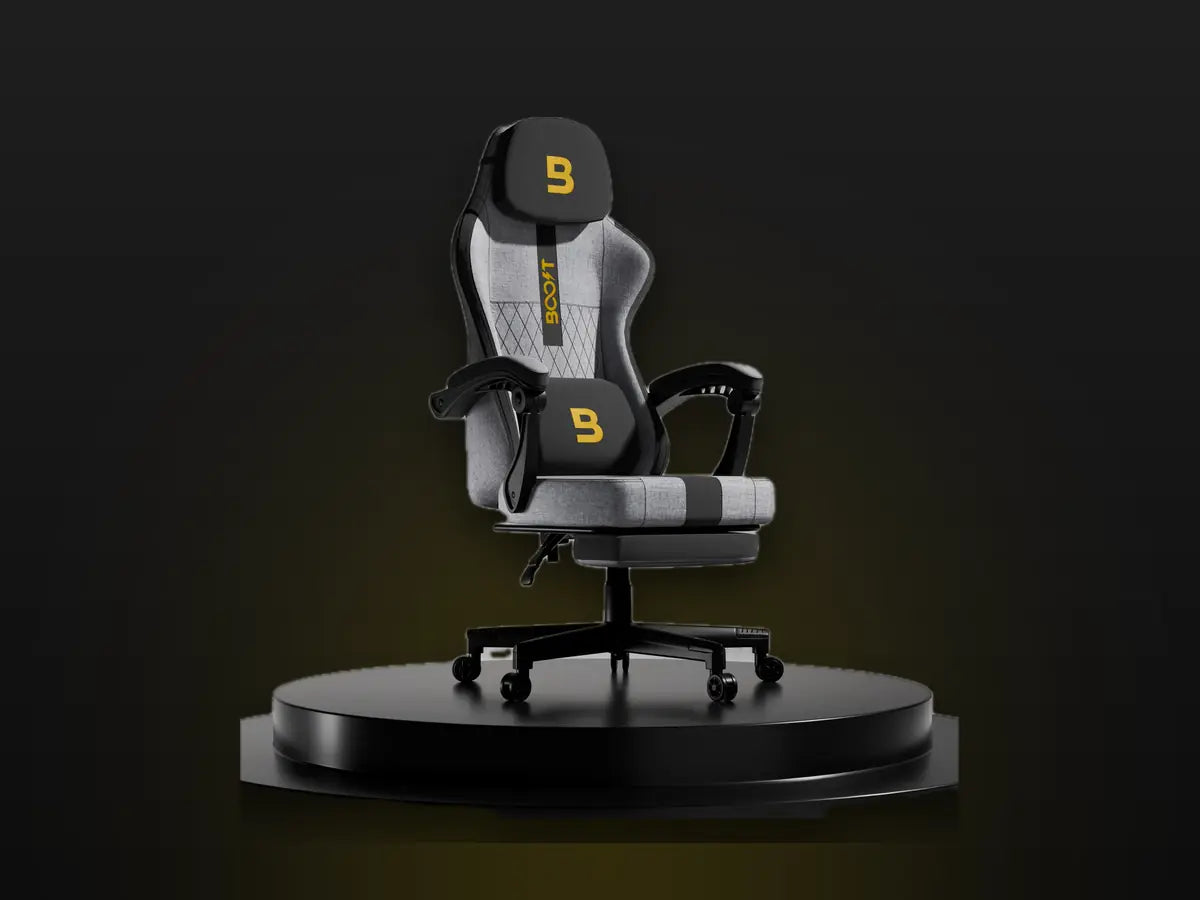 Boost Surge Pro ergonomic chair in grey with footrest on a black podium